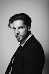 Young bussines man poses for portrait