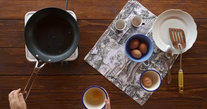 Top view food. Cooking With Mother. Beautiful Little Girl Learns How To Make Fried Egg.