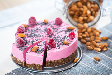 ice cream cake with raspberries, almonds and biscuits