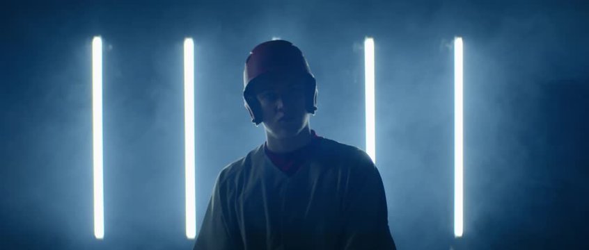 Caucasian professional baseball player batter posing against bright lights. 4K UHD 60 FPS SLOW MOTION shot on ARRI Alexa Mini with Atlas Orion 2x Anamorphic lens