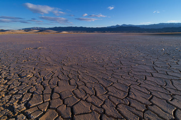 Lake Tecopa in Inyo County, Southern California. During wet years rain temporarily floods the area. In late spring most of the water evaporates forming soft cracked mud.