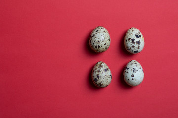 background with four small quail eggs. Eco products. Horizontal format, top view and copy space food