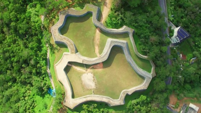 Aerial drone view of Zakimi castle ruins Yomitan Okinawa Japan slow rotation