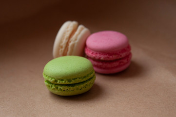 Macaroons different color on craft paper background