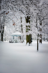 Gazebo in town center covered with freshly fallen snow