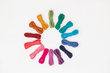 hue circle (color harmony) of various strings on white background. color wheel of colorful threads.  