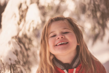 Girl in the snow, smiling