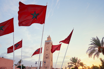 National moroccan flags fluttering in the wind against the sky.