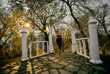 Autumn in the Park, the girl is happy with the good weather.