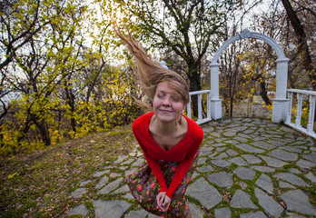 Autumn in the Park, the girl is happy with the good weather.