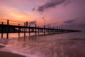Fototapeta na wymiar Sunset breach with pier