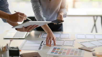 Close-up view of UI designer team planing their smartphone template