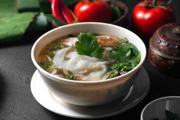 keow teow sup or ladna flat noodles soup in traditional malay style