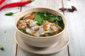 keow teow sup or ladna flat noodles soup in traditional malay style