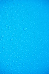 Water Drops On Blue Background.