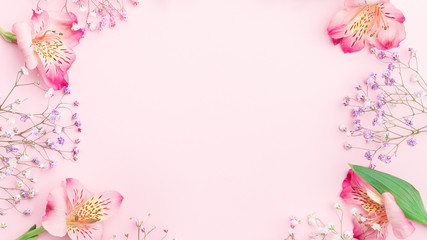 Floral composition. FLowers border frame with  gypsophila and alstroemeria. Flat lay, top view,...