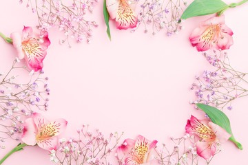 Floral composition. FLowers border frame with  gypsophila and alstroemeria. Flat lay, top view,...