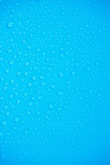 Water Drops On Blue Background.