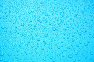 Water Drops On Blue Background.