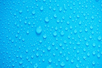 Water Drops On Blue Background.