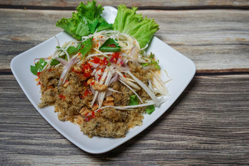 Crispy catfish salad with green mango.