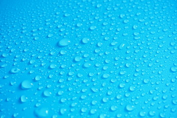 Water Drops On Blue Background.