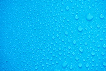Water Drops On Blue Background.