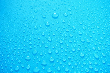 Water Drops On Blue Background.