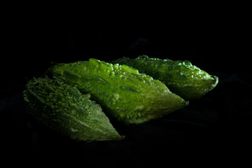 Three Karela Fruits on Black