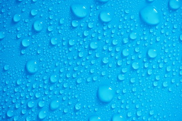 Water Drops On Blue Background.