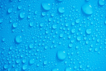 Water Drops On Blue Background.