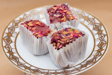 Three slices of fruit rosary turkish delight on a saucer, a trad