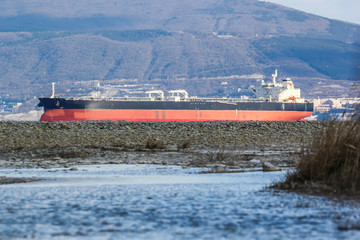 Huge oil tanker entering the port of Novorossiysk for loading