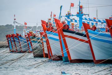 vibrant asian fishing boats in the port