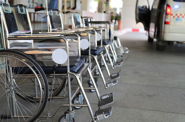 Closeup of wheelchairs preparing for emergency medical service in front of O.P.D.