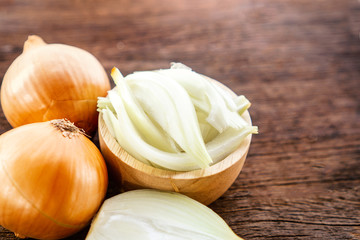 closeup onion cut and slice on wooden table