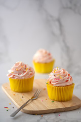 Homemade Birthday cupcake on marble Background.