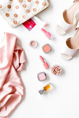 Summer female accessories. Cosmetics, clothes, shoes on white background top-down frame