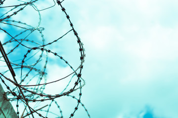 Barbed wire fence attached around prison walls and Border wall for protection corona virus.Wuhan coronavirus and epidemic virus symptoms.Worldwide virus symptoms.Close city.Close countries concept.