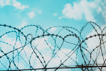 Barbed wire fence attached around prison walls and Border wall for protection corona virus.Wuhan coronavirus and epidemic virus symptoms.Worldwide virus symptoms.Close city.Close countries concept.