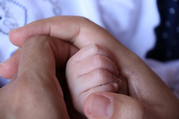 Fototapeta premium hands of mother and baby
