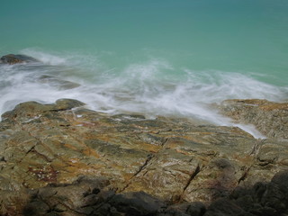 view seaside of silky wave attack many arch rocks with blue-green sea background, Khao Lak-Lam Ru National Park, Phang Nga, southern of Thailand.