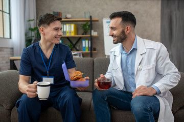 Two doctors having breakfast during the changeover