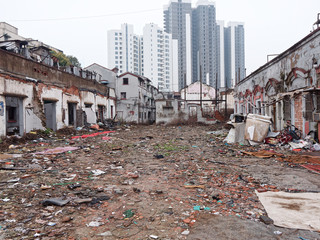The waste land in the demolition site with modern buildings background in Shanghai, China.