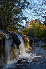 Image of an oil stain in a mountain stream.