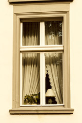 Old fashioned vintage window with curtain