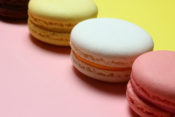 colored almond cakes on a multicolored background