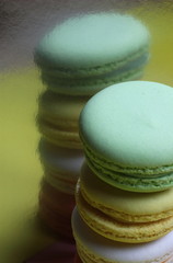 delicious French colored cakes on a multicolored background
