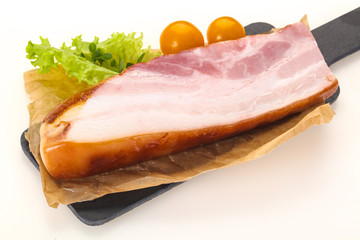 Smoked pork breast with salad leaves