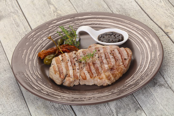 Grilled pork steak with pepper sauce